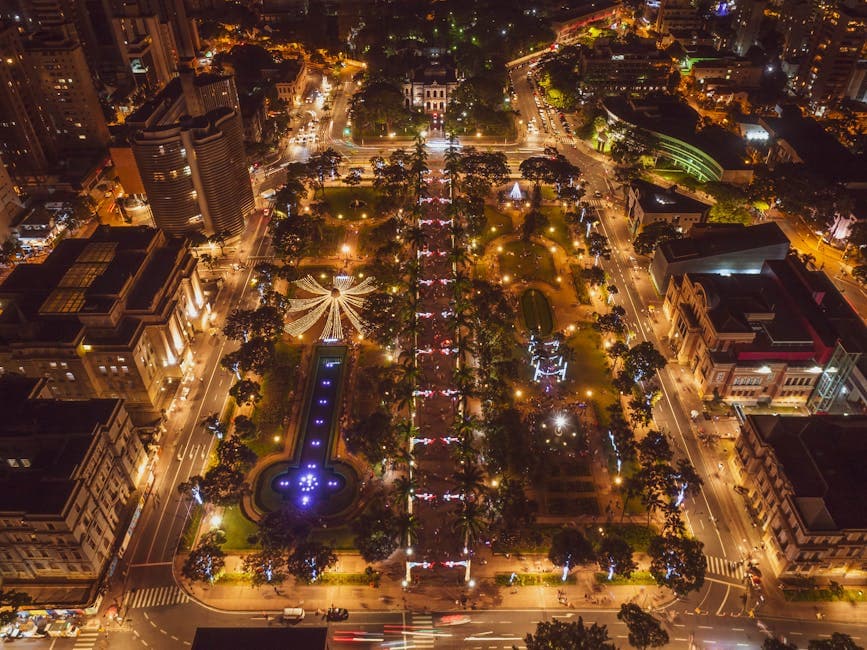 Stunning aerial view of illuminated Belo Horizonte cityscape at night, highlighting urban lights and architecture.