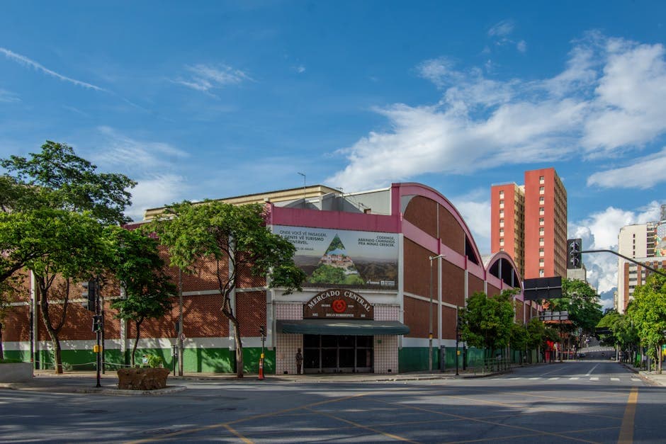 Exterior view of Mercado Central in Belo Horizonte, Brazil under a bright blue sky.