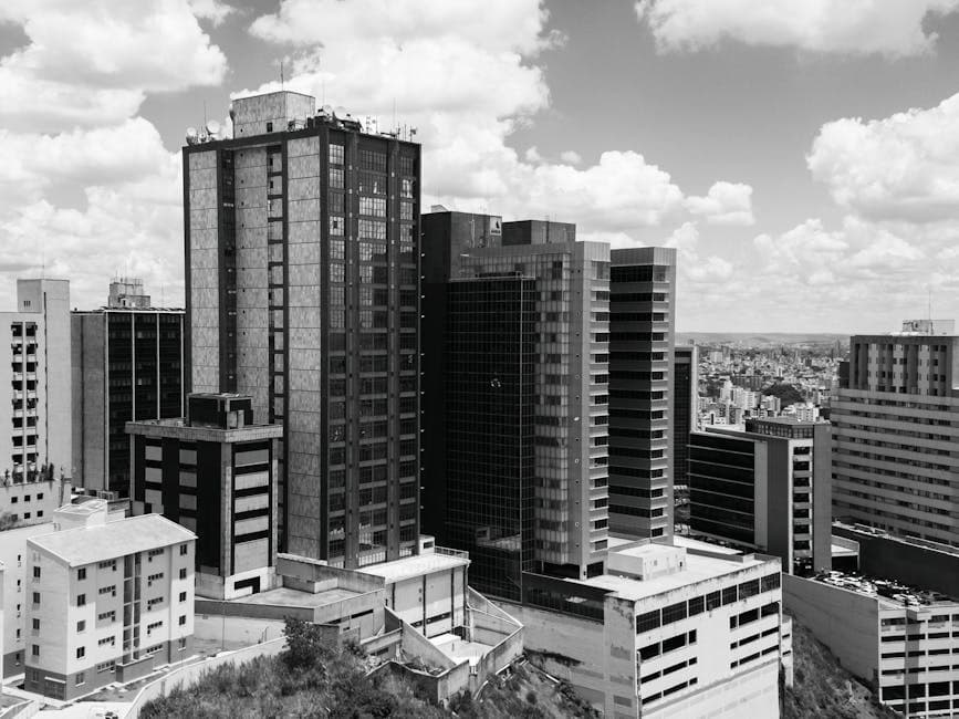 Dramatic black and white photograph capturing the urban skyline of Belo Horizonte, Brazil.