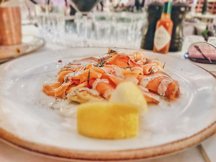 A delicious smoked salmon dish garnished with dill, served at a restaurant in Lisbon, Portugal.