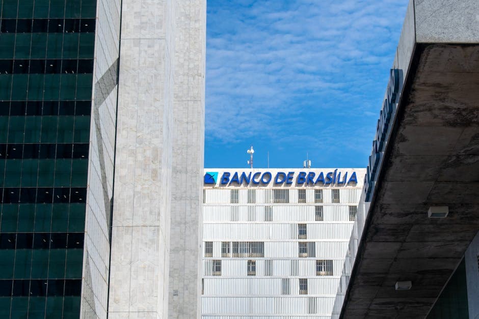 Modern architectural view of Banco de Brasília against a clear blue sky, highlighting urban design.
