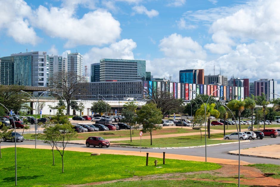 This vibrant photo showcases the modern skyline of Brasília with a mix of greenery and urban architecture.