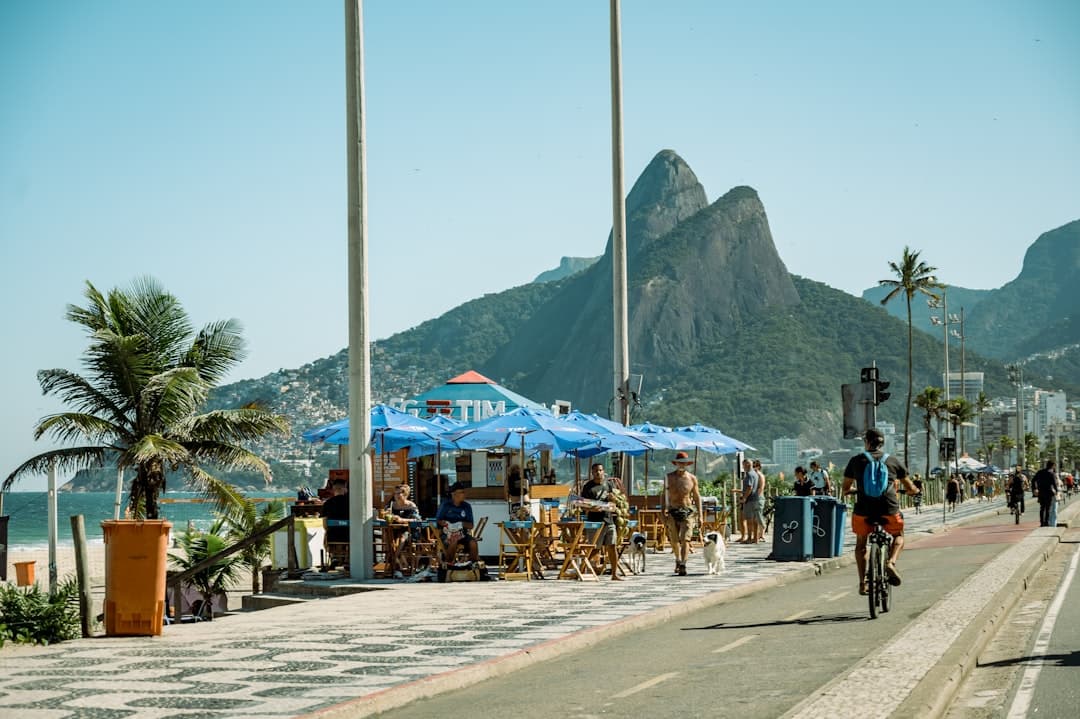 A group of people riding bikes down a street