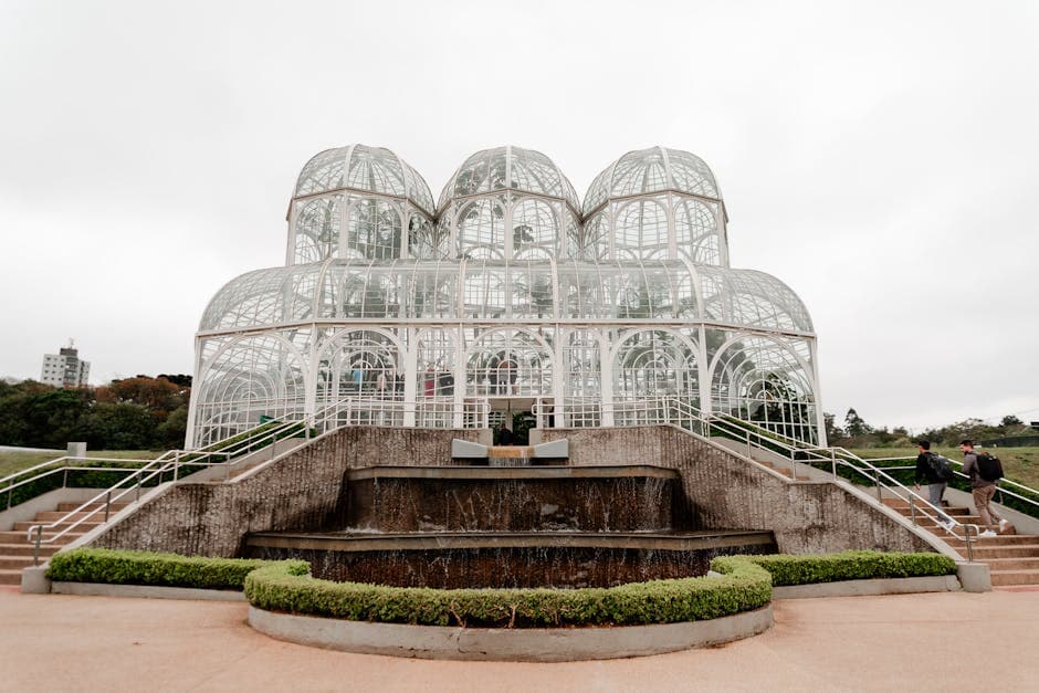 Elegant glasshouse architectural landmark in a botanical garden, Curitiba.