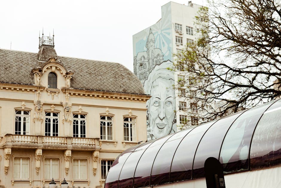 A blend of historic architecture and modern street art in Curitiba's vibrant urban landscape.