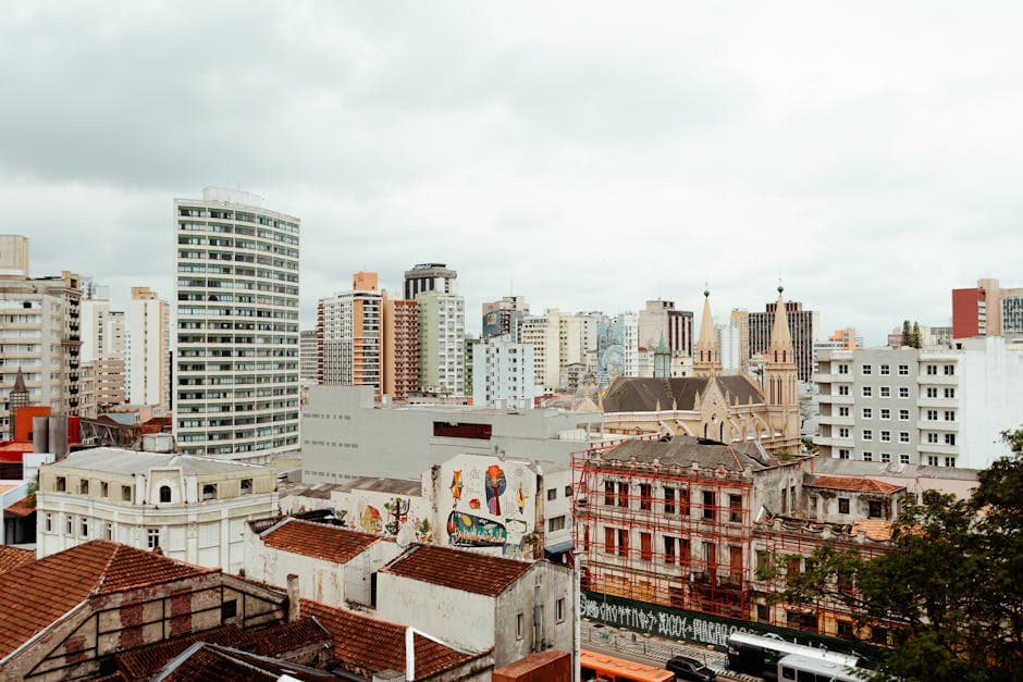 A stunning aerial view of Curitiba's skyline featuring modern skyscrapers and historic buildings.