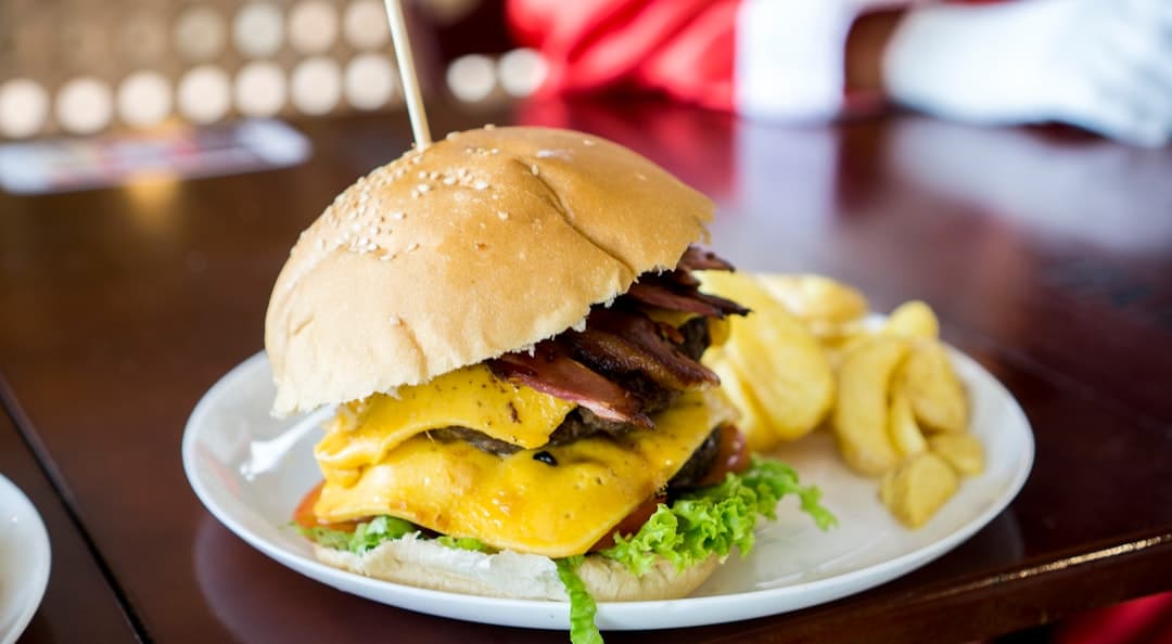shallow focus photo of bacon and cheese burger