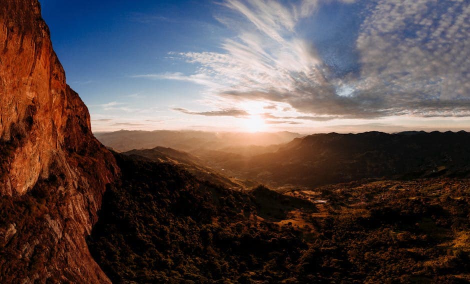 A stunning sunrise over the São Bento do Sapucaí mountains, capturing the vibrant landscape and dramatic skies.