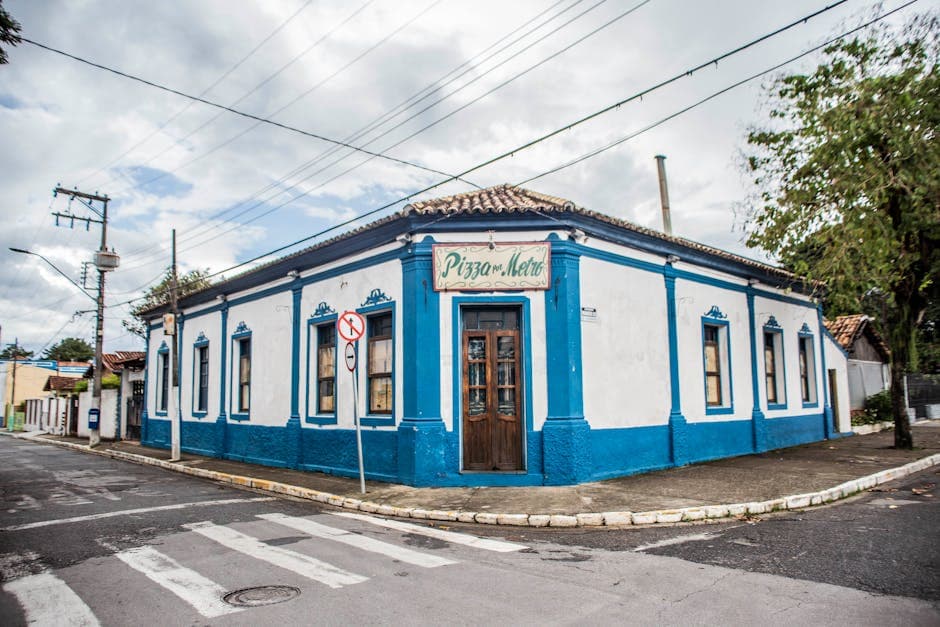 Colorful colonial-style pizza restaurant on a quiet street corner.