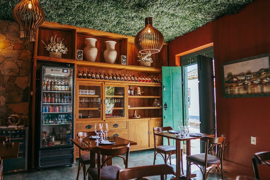 Cozy Brazilian bar in Tiradentes featuring a wine display and rustic decor.