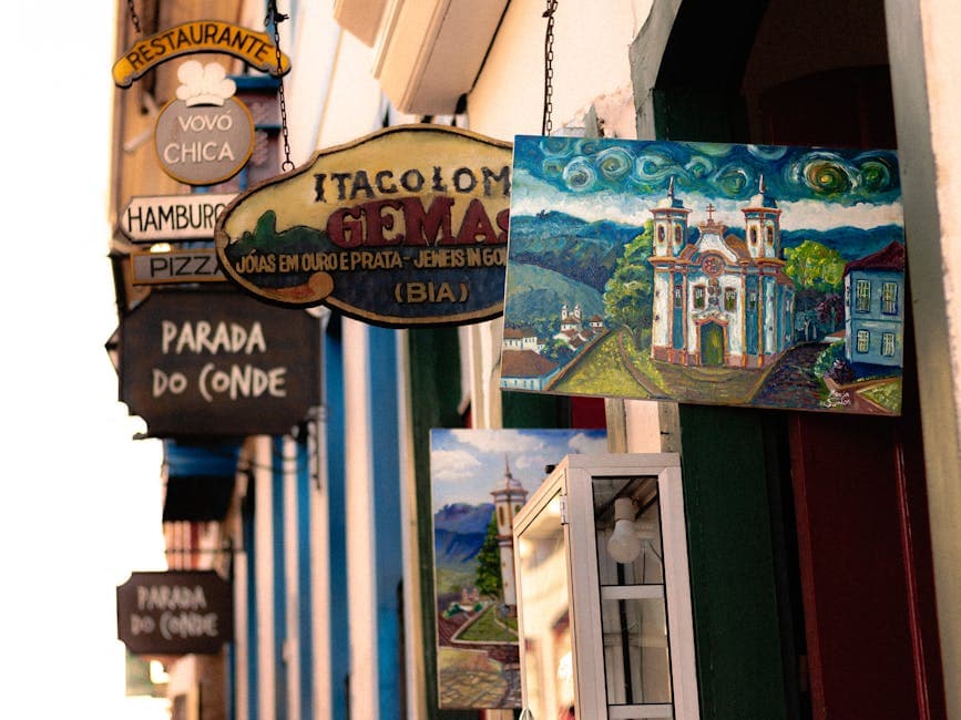 Colorful street showcasing signs and artwork in Ouro Preto, Brazil, capturing vibrant city life.