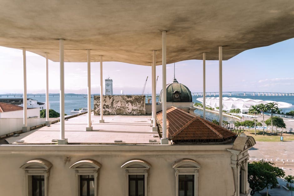 View of Rio de Janeiro's coastal architecture featuring modern and historic buildings with ocean backdrop.