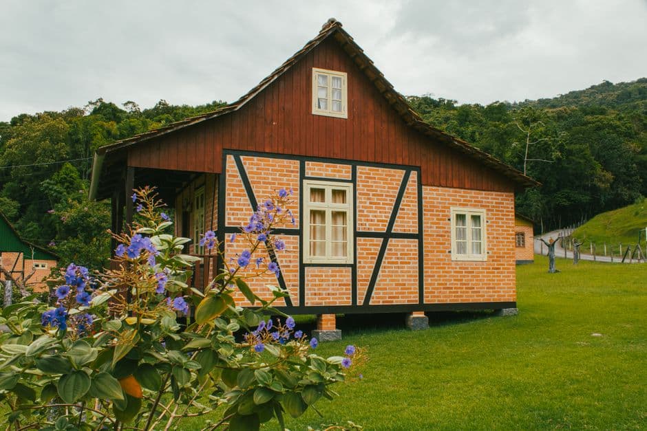 Beautiful colonial-style Fachwerk house surrounded by lush greenery in Santa Catarina, Brazil.