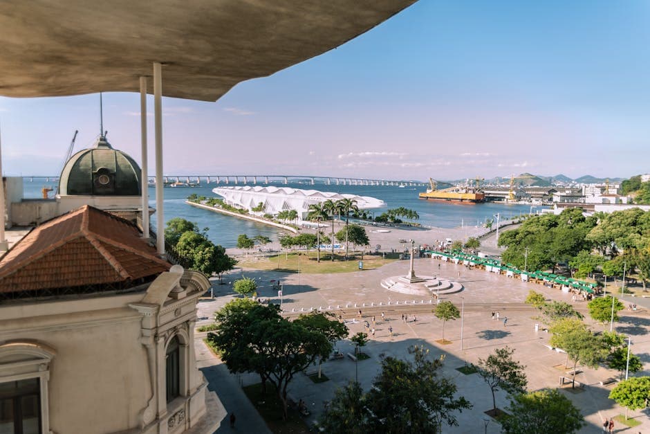 Scenic view of Mauá Square and Museum of Tomorrow in Rio de Janeiro, featuring a distant bridge and waterfront.