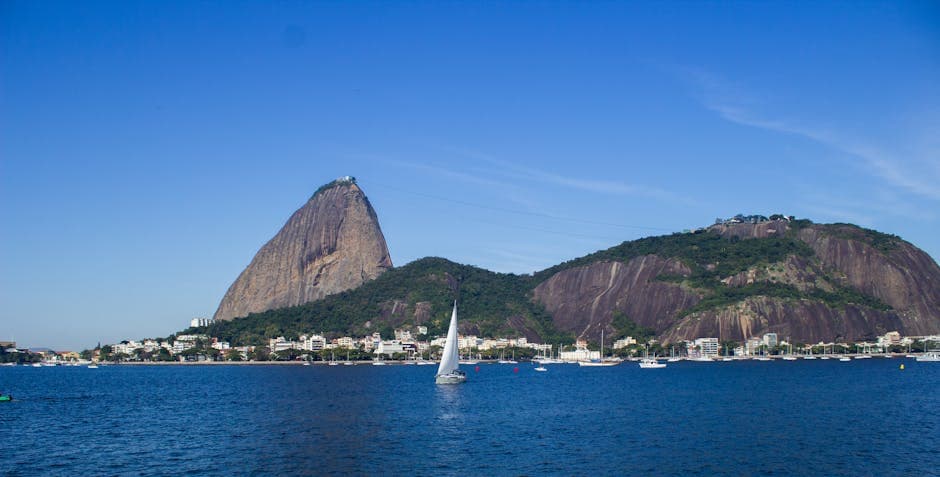 Scenic view of Sugarloaf Mountain with sailboats on a sunny day in Rio de Janeiro, Brazil.
