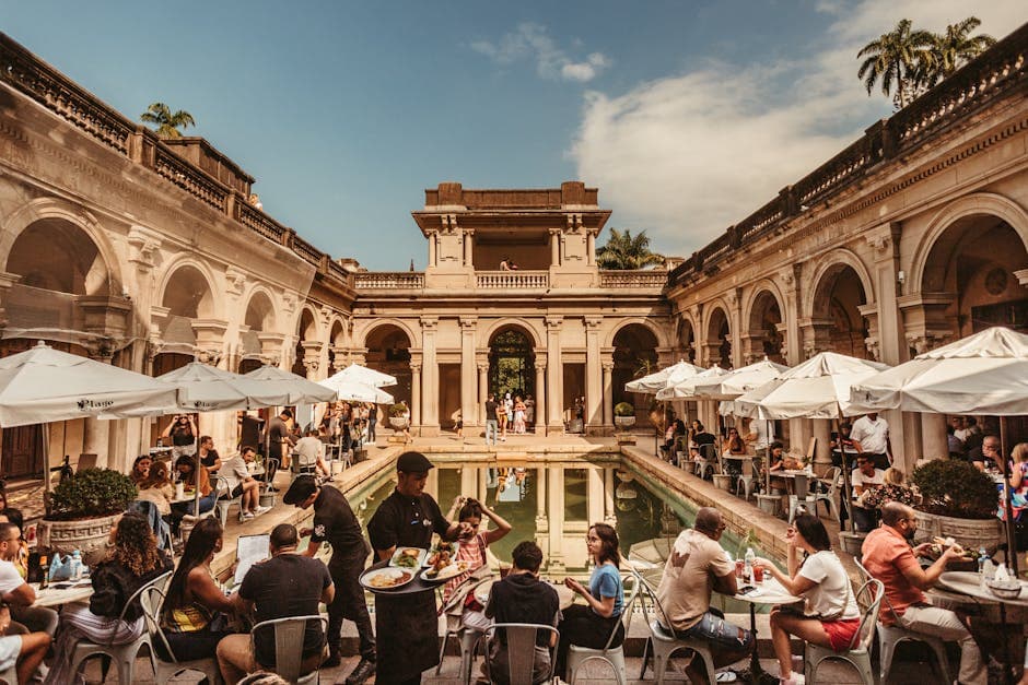 Capture a vibrant social scene at a historic palace café in Rio de Janeiro.