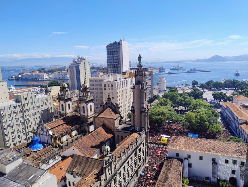 Aerial view capturing the vibrant skyline and architecture of Rio de Janeiro overlooking Guanabara Bay.