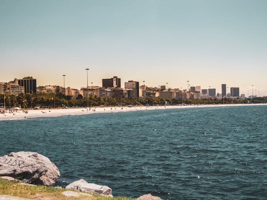 Beautiful beachfront in Rio de Janeiro with cityscape and ocean views.