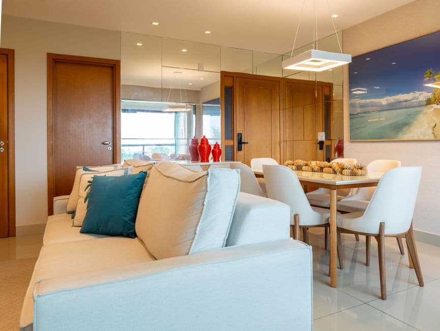 Stylish living room in Salvador, Brazil featuring modern decor, cozy furniture, and vibrant accents.
