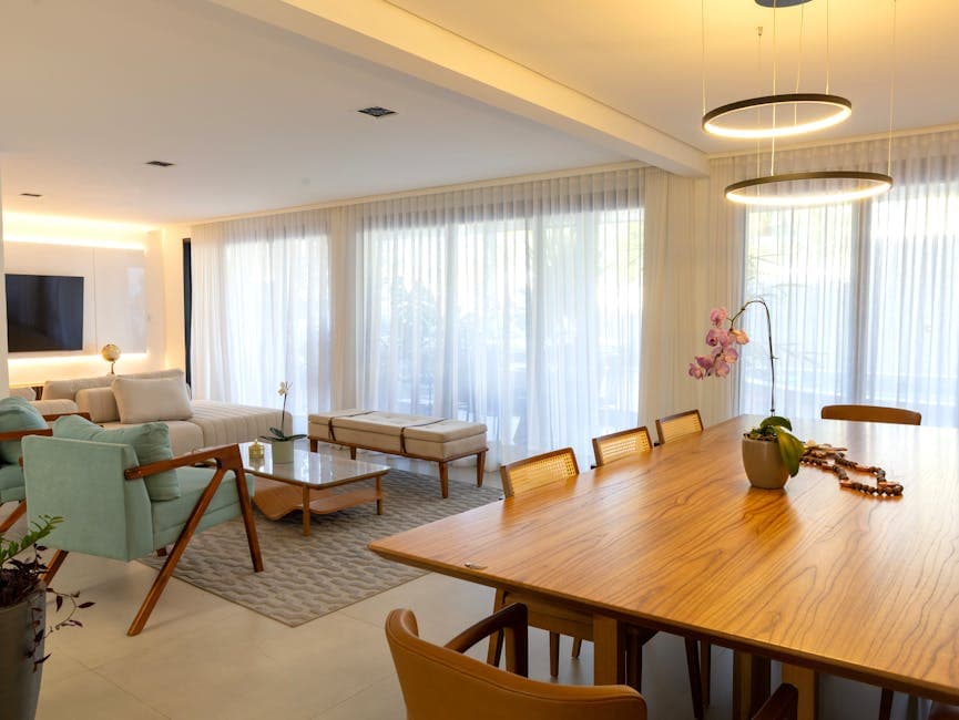 Spacious and stylish dining room with natural light and modern decor in Salvador, Bahia.