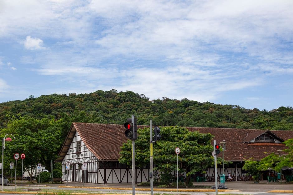 Scenic view of a half-timbered building and lush greenery in Joinville, Brazil.