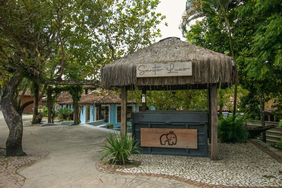 Idyllic thatched-roof kiosk in a scenic outdoor setting in Bahia, Brazil.