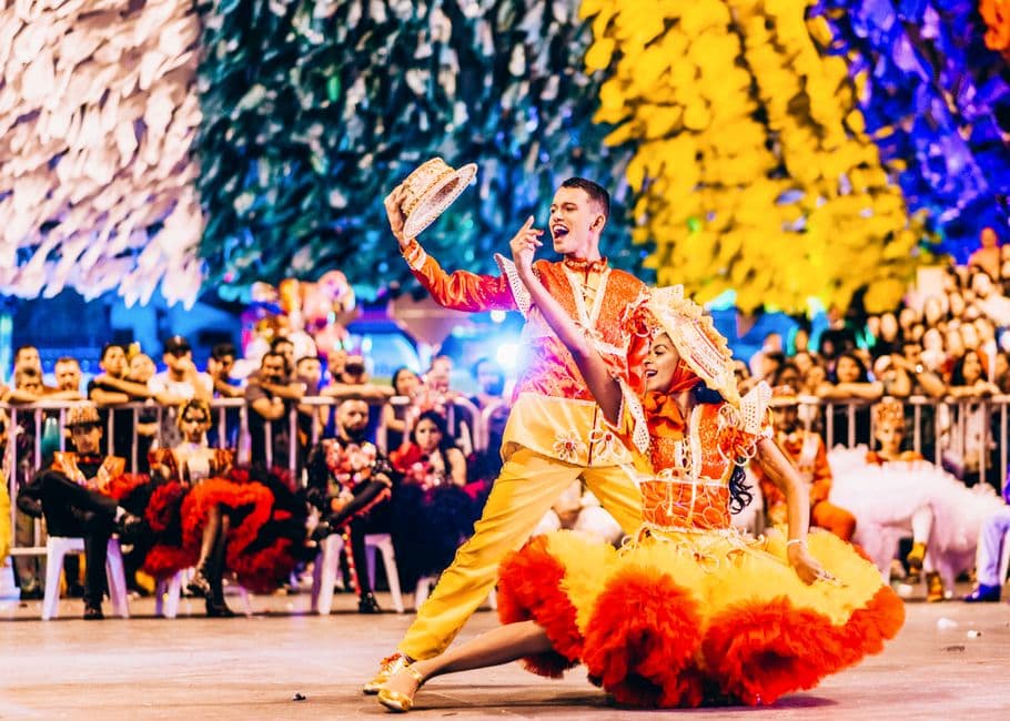 Colorful dancers performing at a traditional Brazilian festival in Campina Grande.