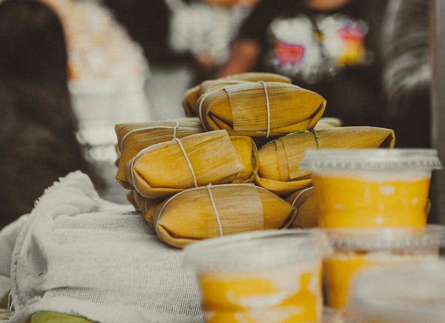 Close-up of delicious pamonha bundles at a São Paulo food stall. Perfect for culinary enthusiasts.