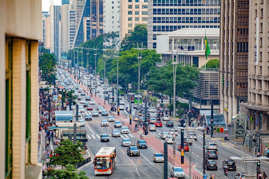 Aerial view of bustling Avenida Paulista in São Paulo, showcasing urban life and busy traffic.