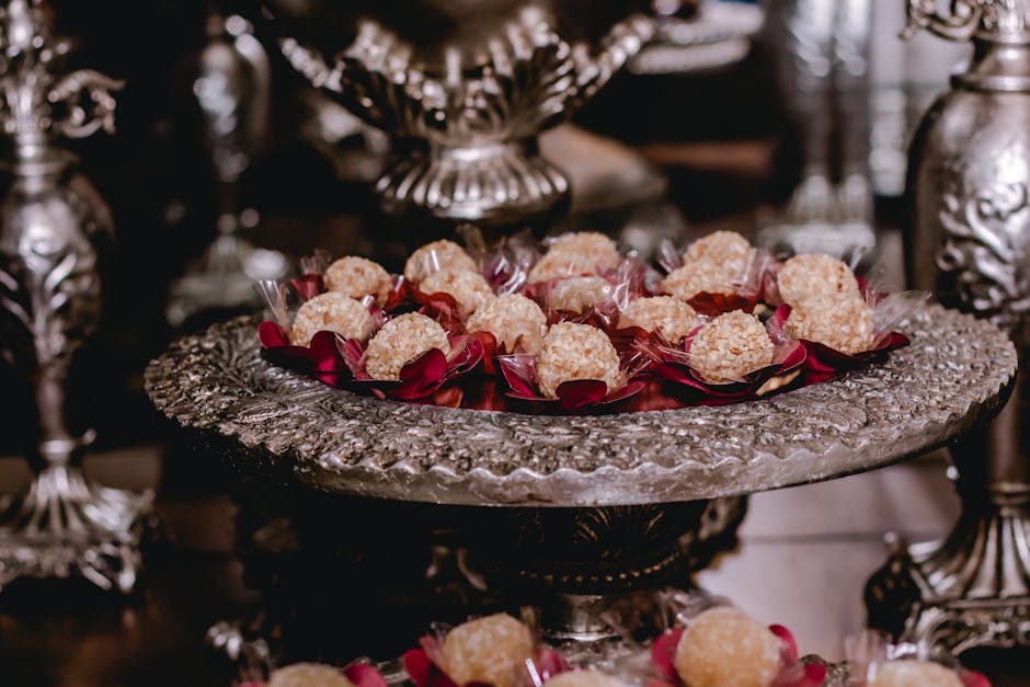 Luxurious tray of gourmet truffles elegantly displayed on ornate metallic platter.