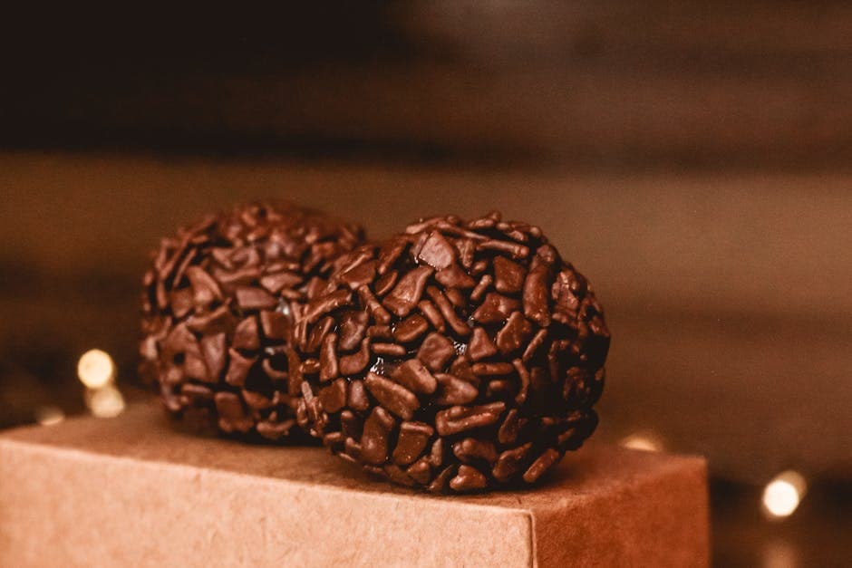 A close-up view of rich chocolate brigadeiros, a classic Brazilian dessert delight.