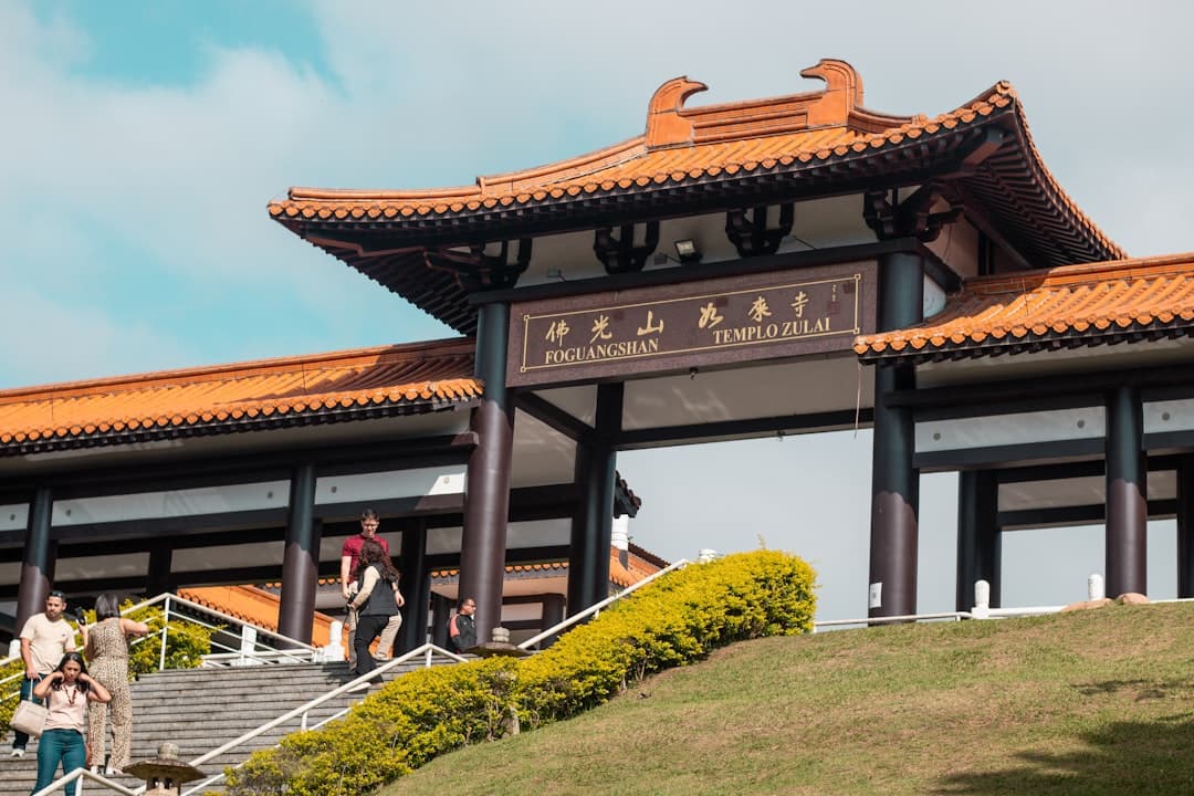 A buddhist temple entrance welcomes visitors.