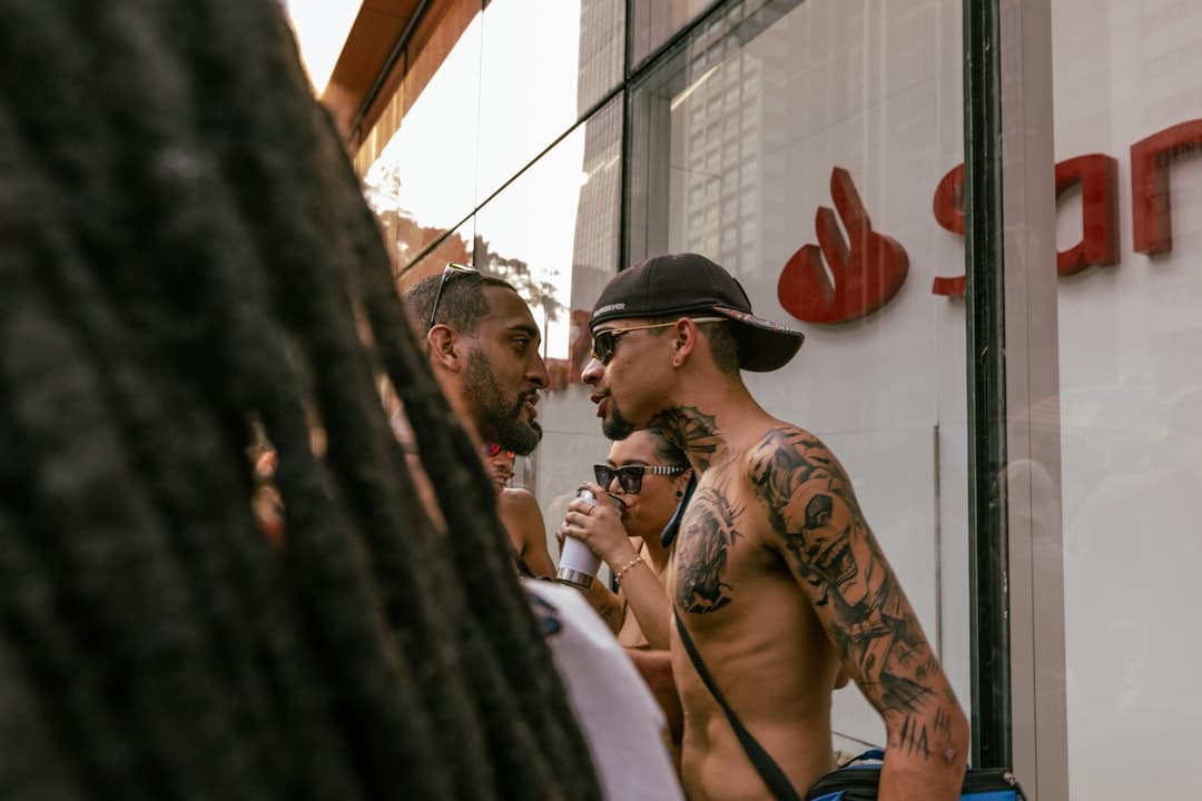 A group of men standing next to each other in front of a store
