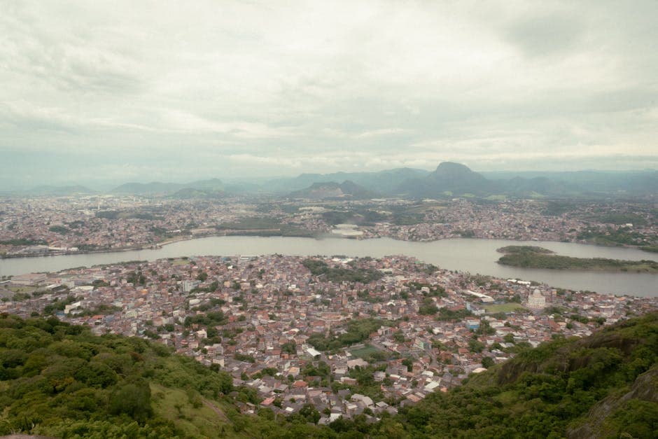 Stunning aerial view of Vitoria, ES, Brazil with lush greenery and water bodies.