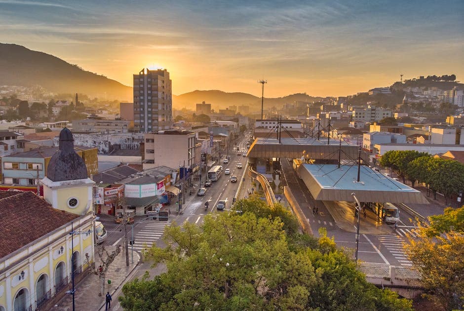 Aerial view of Poços de Caldas during sunrise showcasing its vibrant urban landscape.
