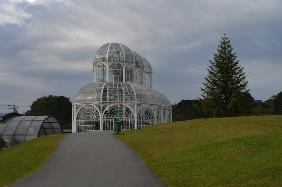Beautiful glass greenhouse at Universidade Federal do Paraná, Curitiba, showcasing elegant architecture.