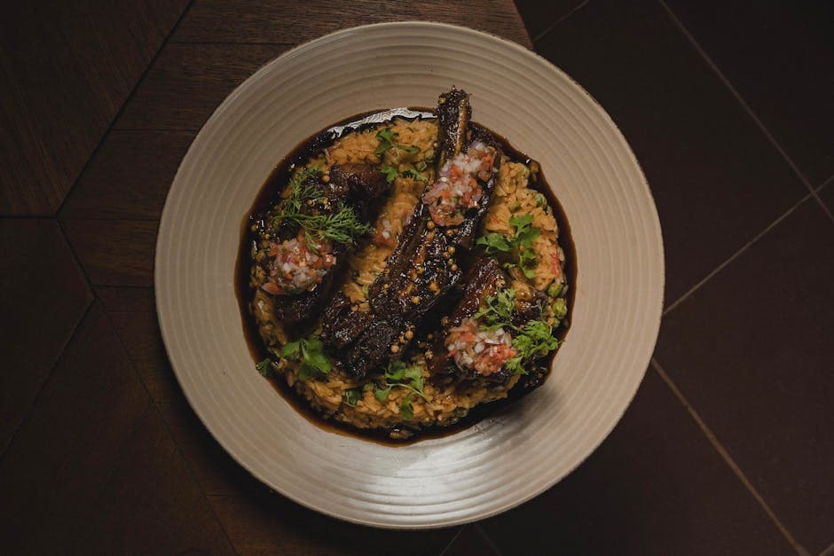 Delicious gourmet dish featuring roasted eggplants and rice, plated elegantly, served in Rioja, Peru.