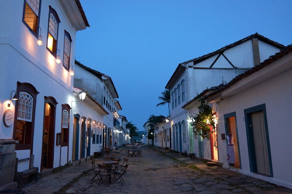 Beautiful cobblestone street in Paraty, Brazil, with colonial architecture illuminated during dusk. Perfect travel destination.