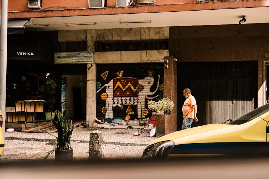Vibrant street art scene in Rio de Janeiro, Brazil featuring an elephant mural and urban life.