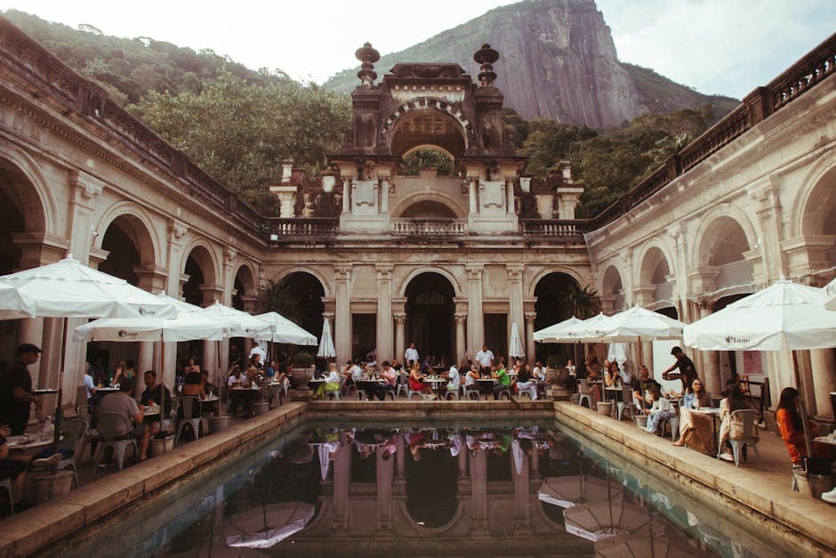 People enjoying the sun and sea at a picturesque beach in Rio de Janeiro, Brazil.