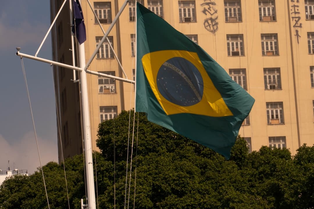 Brazilian flag waving in front of a building