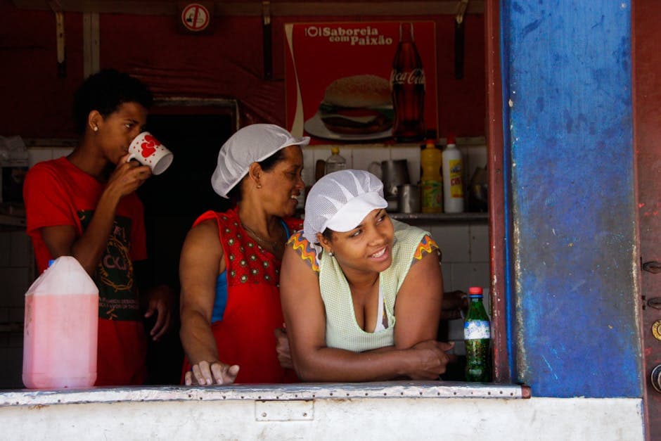 Three people enjoying a casual day at a café in Mindelo, Cape Verde.