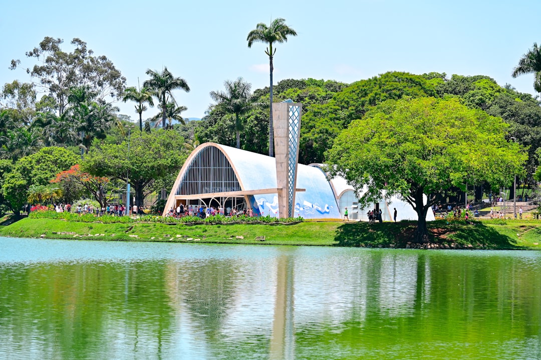 a large building sitting on top of a lush green field