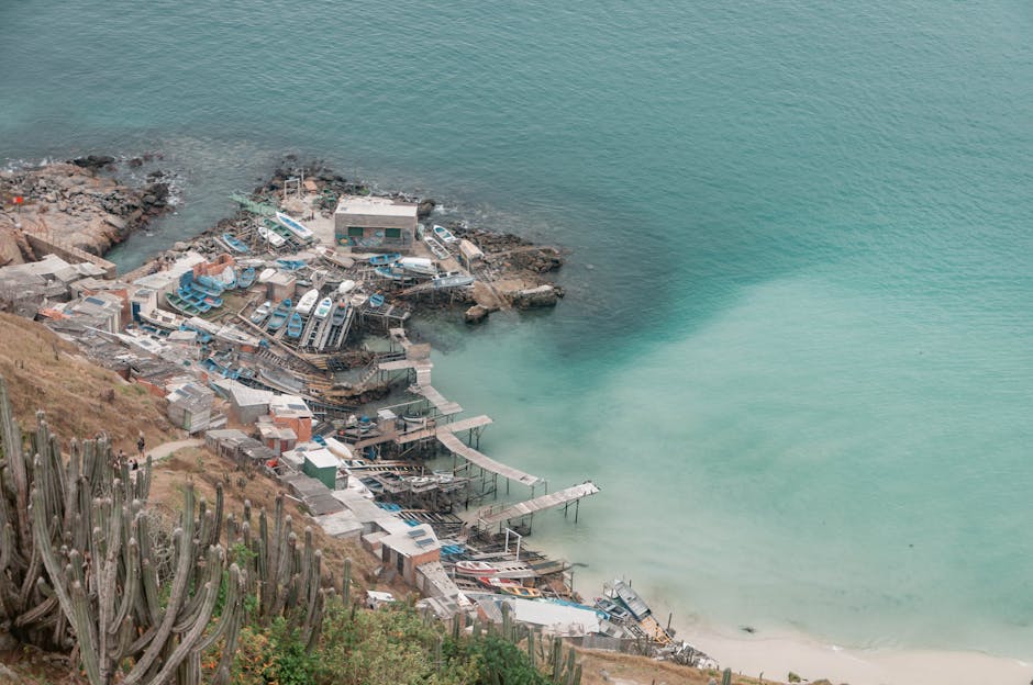 A scenic aerial view of a fishing village and coastline in Arraial do Cabo, Brazil.
