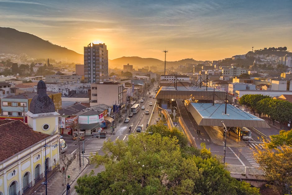 Aerial view of Poços de Caldas during sunrise showcasing its vibrant urban landscape.