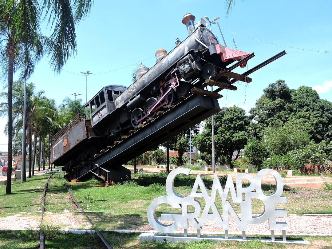 Old train on display with campo grande sign