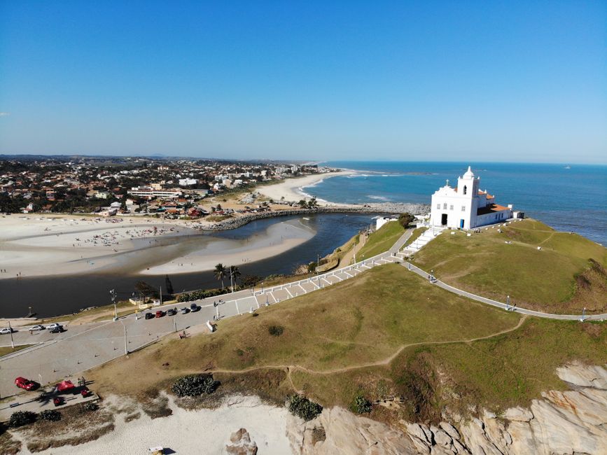 Drone shot of Nossa Senhora de Nazareth Church and the beautiful coastline in Saquarema, Brazil.