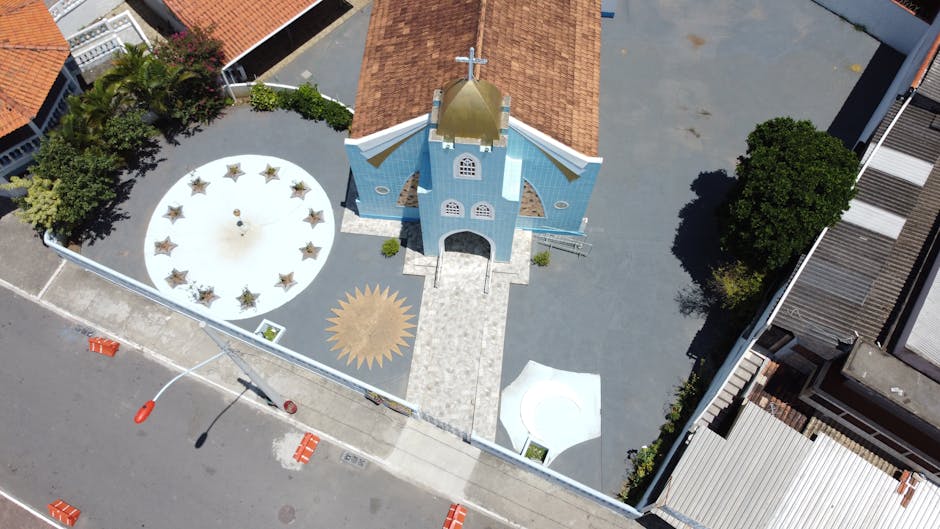 Aerial photo of a blue church with unique design in Ponta Negra, RJ, Brazil.
