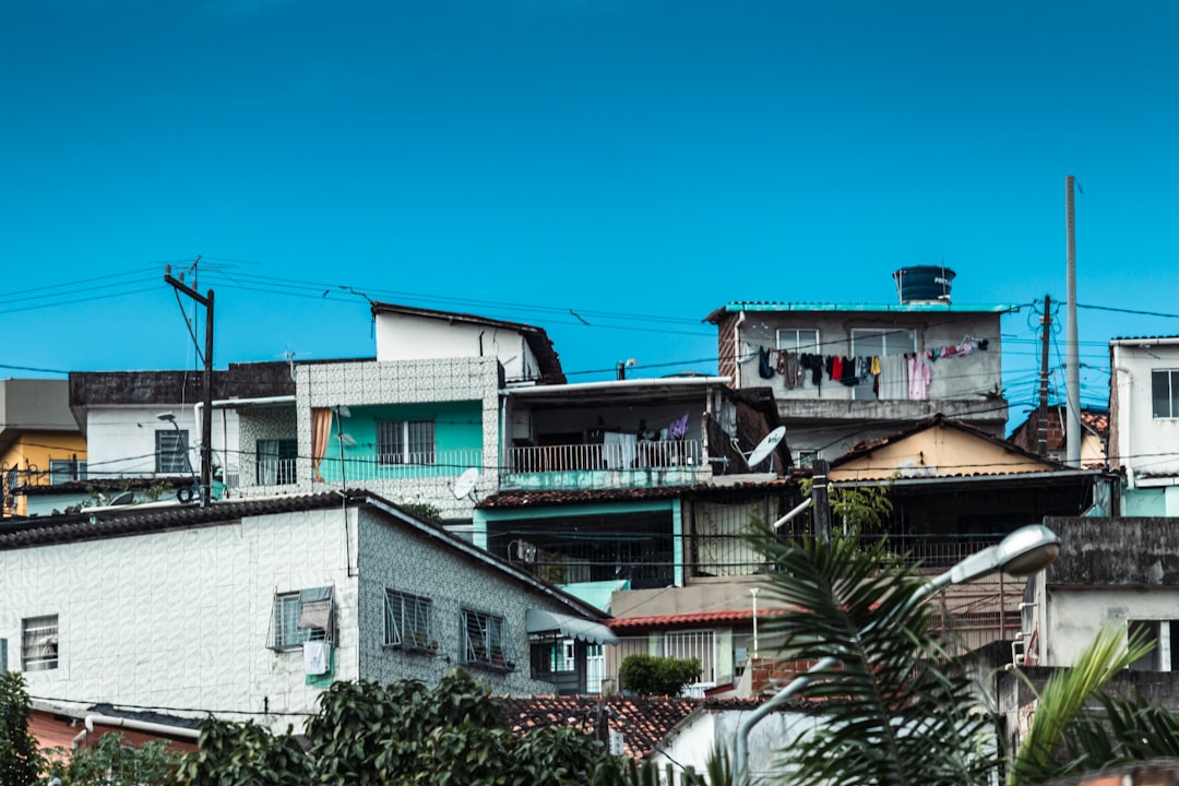 a group of buildings with trees in front of them