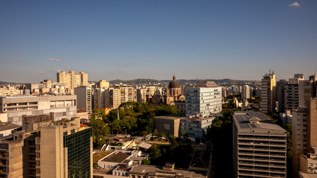 City skyline with buildings and a dome under clear sky